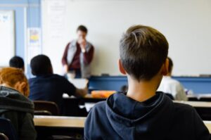 Image of students in a classroom, representing the importance of eliminating discrimination in WV schools and how The Law Office of M. Andrew Brison can help when students’ civil rights are infringed.