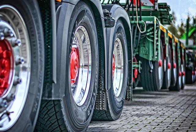 Image of the wheels on a commercial truck and trailer, representing the need for effective West Virginia trucking accident defense and how The Law Office of M. Andrew Brison, PLLC can help.