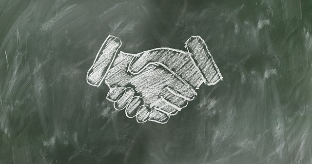 Image of a chalkboard handshake to show how hiring M. Andrew Brison gives you the benefit of small law firm advantages.